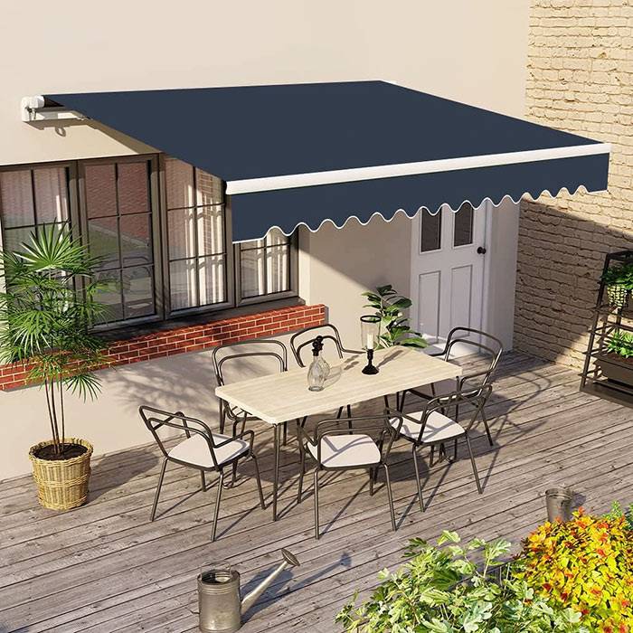 Greenbay Retractable Awning open over a patio, with a table and 6 chairs below