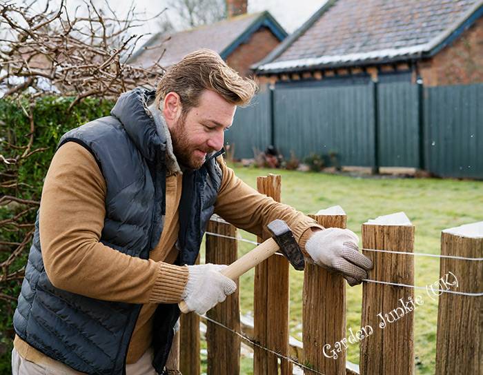 Man Repairing a Fence